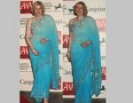 Theresa May's kitten fever continues with turquoise blue sari at Asian Award