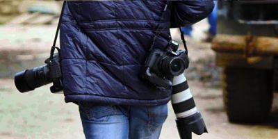 Photojournalist beaten after taking photographs of lover couple in rain