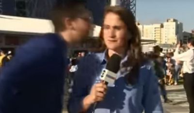 Man tries to kiss a woman journalist in front of the camera in FIFA World Cup