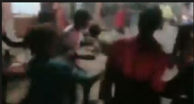 A crowd brutally thrashing a policeman in uniform for this silly reason