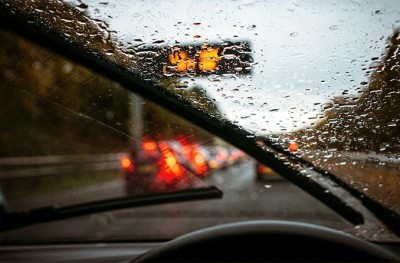 How do you keep yourself and others safe while driving in the rain?