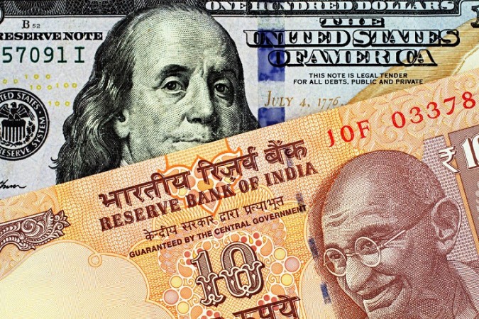 Rupee drops 11 paise to a new low of Rs.77.85 against Dollar