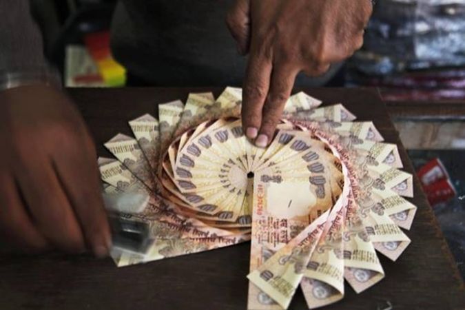 Rupee edged up by 17 paise against dollar to 63.87
