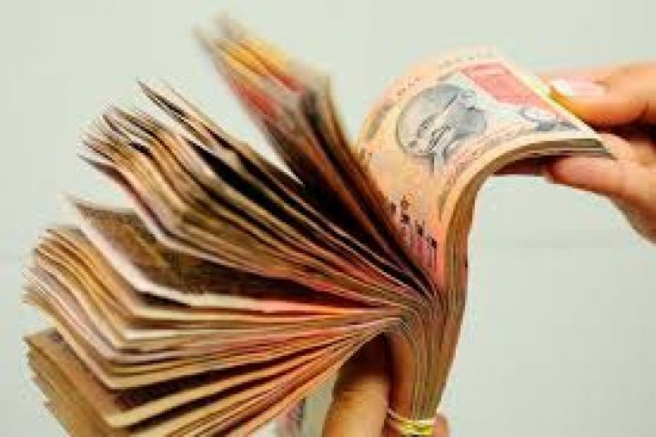 Rupee is trading lower by 12 paise at 67.18 against USD