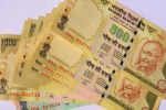 Rupee extends gain at 67.06 against US dollar