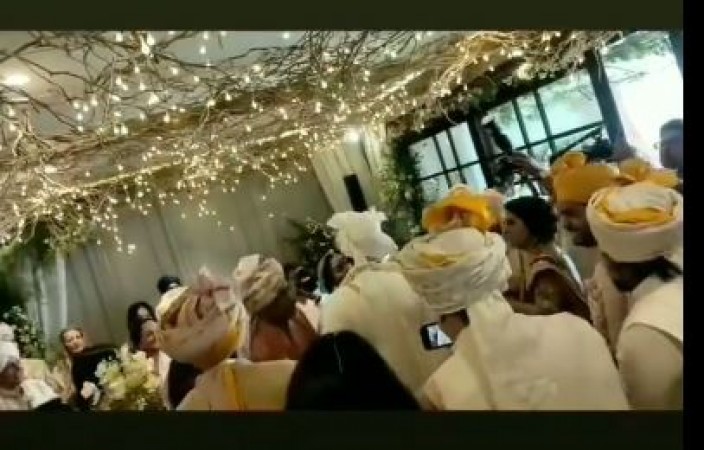 VIDEO: Ranbir Kapoor wore a garland and got a liplock from his wife Alia while sitting on his knee