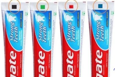 What do the different colored strips on the tube of toothpaste mean?