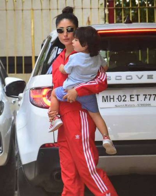 Taimur posed for media by sitting on mother Kareena's lap!