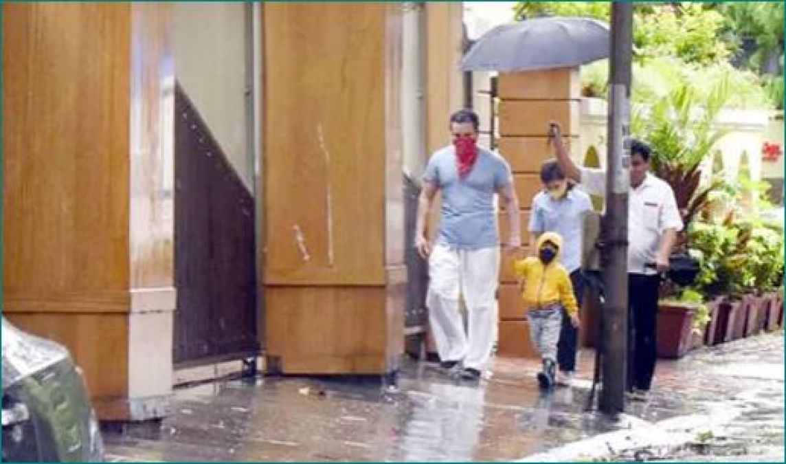 Taimur Ali Khan spotted enjoying rain with his father