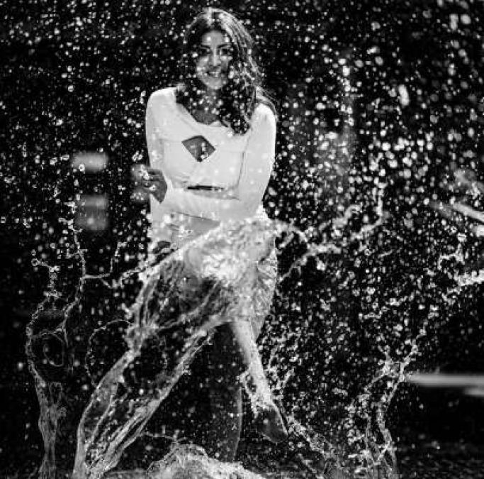 Kajal Agarwal, playing with water, looked extremely hot in a white dress!