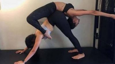 This actress along with her fitness trainer undertakes difficult Yoga poses!