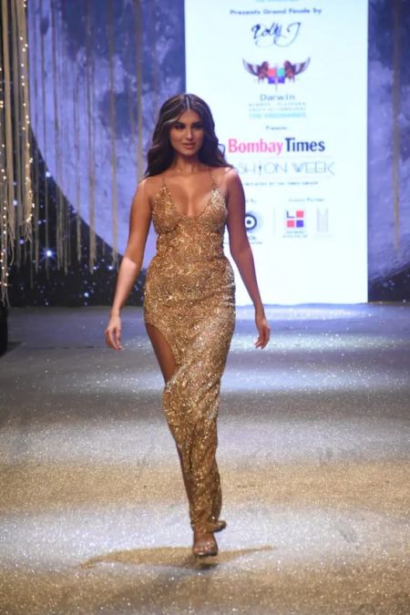 Tara's ramp walk at Fashion Week set ablaze a Thai high slit gown from above