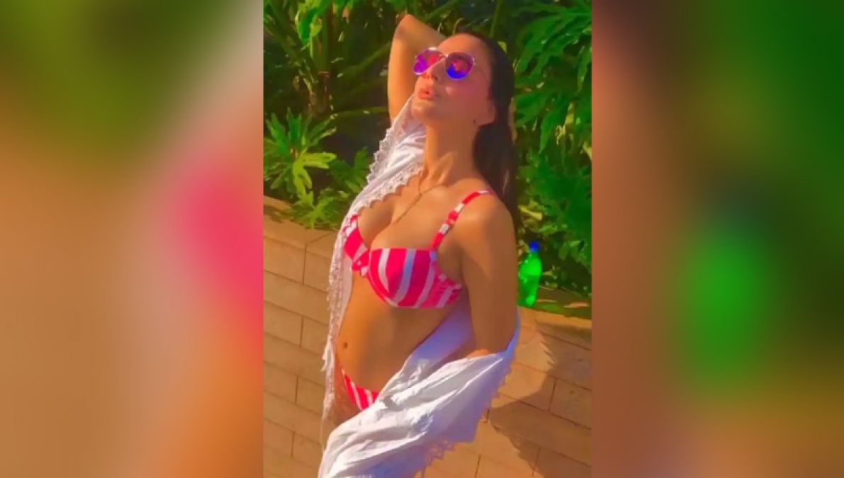 Ameesha in a white bikini sets social media on fire...