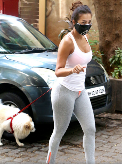 Bollywood actress Malaika Arora spotted with her pet dog on the streets of Mumbai