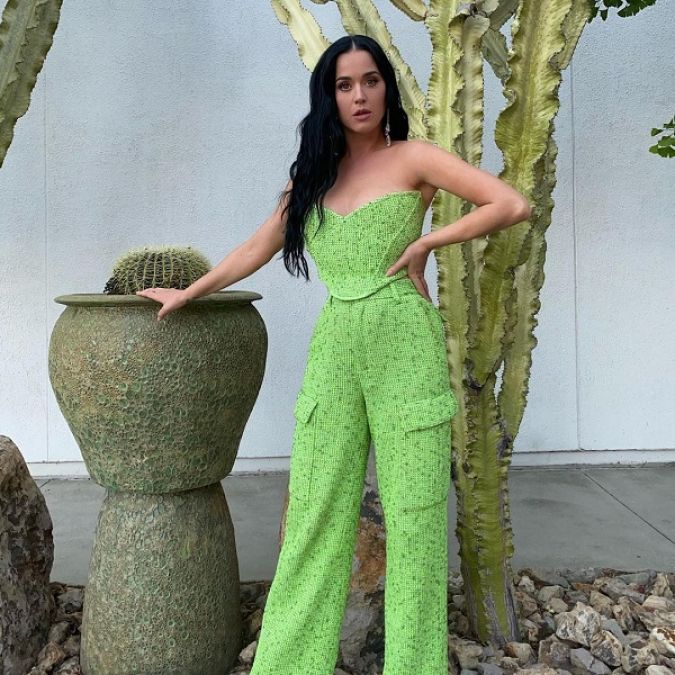 Katy Perry's unique look in a green off-shoulder top and open hair