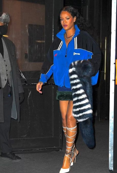 Rihanna spotted with her boyfriend in a blue and black windbreaker jacket