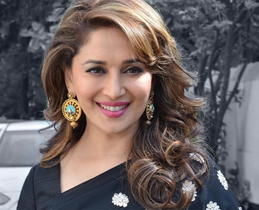 You may not have seen this sexy look of 'Madhuri Dixit' in a red sari; see here!