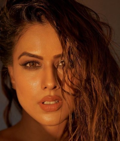 Nia Sharma arrives at airport wearing reviling dress, photos set internet on fire