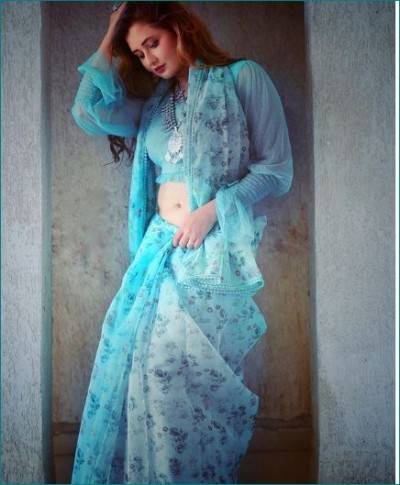 Rashmi Desai looks glamorous in a blue saree