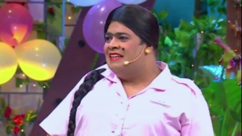 Why does Kiku become a woman on The Kapil Sharma Show?