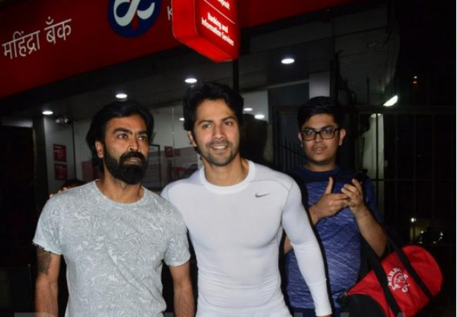 Photo! Six-packs Varun Dhawan gives a smiling pose for camera as he exits the gym