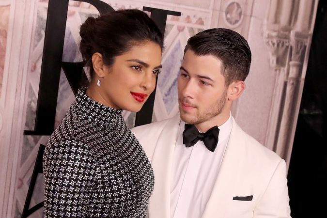 Check out  the intimate lip-lock of Priyanka Chopra and Nick Jonas  in a parking lot, see photo here
