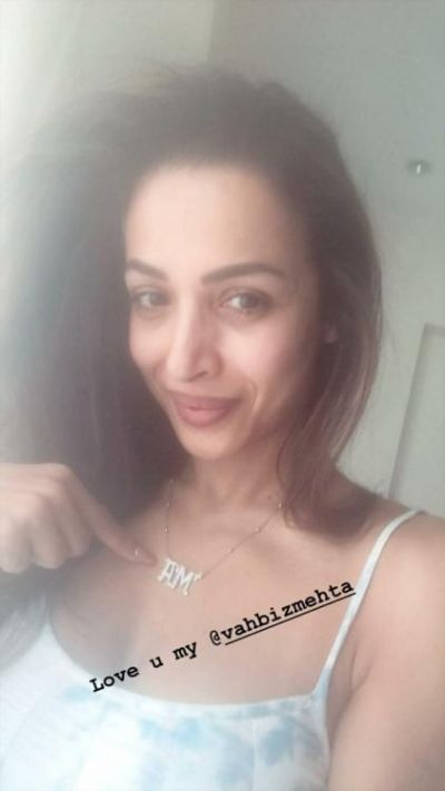 See photo : Malaika Arora wears a pendant with AM initials, Does A stand for Arjun Kapoor?