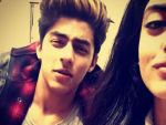 Navya and Aryan poses together at their last day of school