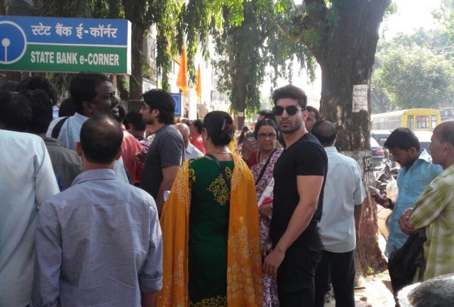 An actor spotted in a queue outside the bank