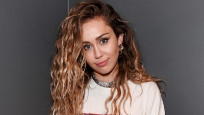 Vogue photo shoot : Miley Cyrus rocks bunny ears and pink hair in fanciful Clicks