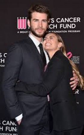 Watch -Miley Cyrus confirms wedding  by kissing Liam Hemsworth and dancing to Uptown Funk in wedding gown