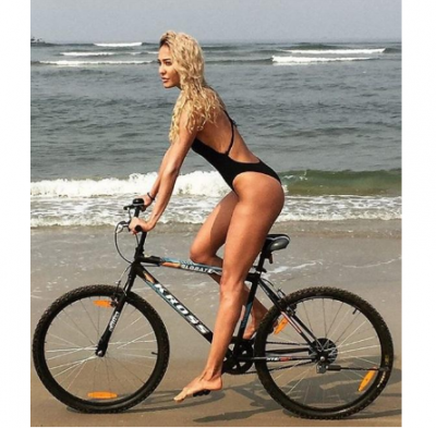 Lisa Haydon looks erotic while cycling on a beach