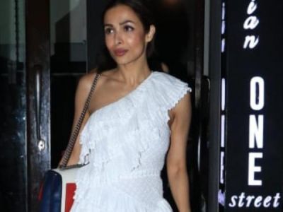 Malaika Arora looks like a total diva In a little white dress and holographic heels