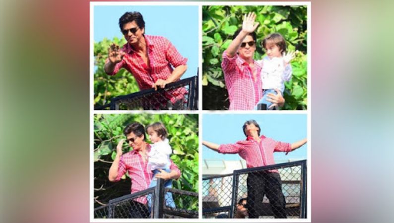SRK and AbRam Khan waving at the fans enthusiastically