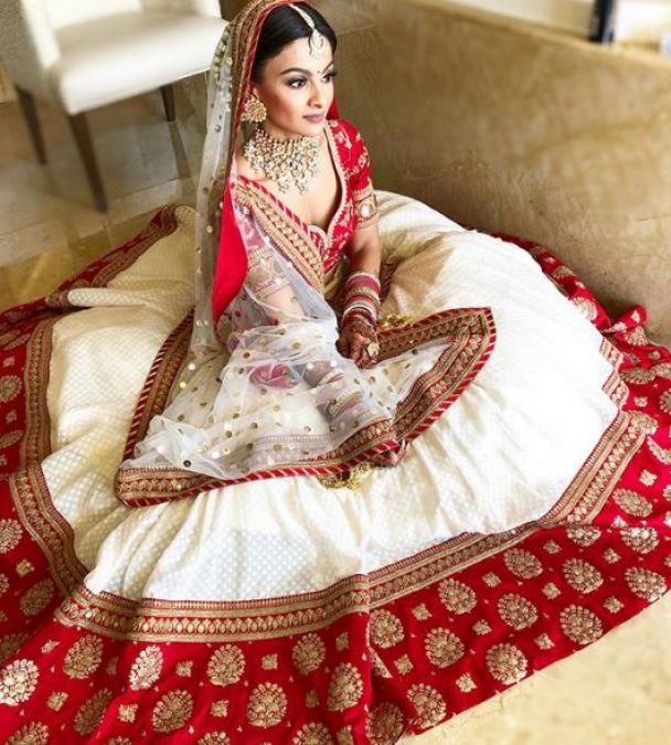 If you're thinking of something different at the wedding, try this red and white lehenga