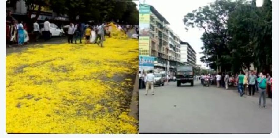 Mumbaikar sprinkles flowers as the convoy carrying mortal remains of Major Kaustubh Prakash Kumar Rane passed through