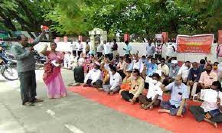 The teachers staged a sit-in in front of the district collectorate here on Saturday