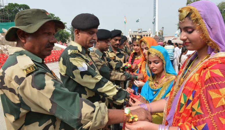 Women tie Rakhi to Indian soldiers at LOC