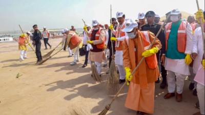 UP CM Yogi Adityanath leads cleanliness drive on Arail Ghat after Mahakumbh culmination, eats food with sanitation workers