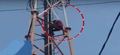 Farmer threatens to suicide after climbing on an electricity pole