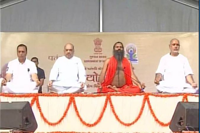 Yoga guru Ramdev and Gujarat Chief Minister Vijay Rupani participate in Yoga Day celebrations