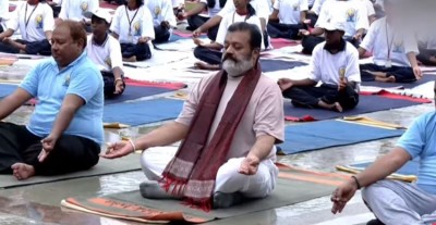Union Minister Suresh Gopi Braces Rain, Skips Umbrella at Yoga Day