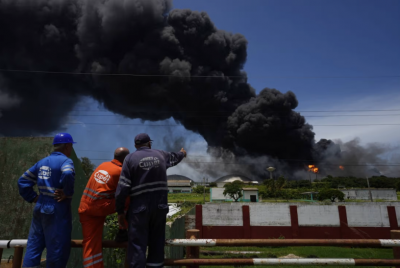 Fire rages in a Cuban oil tank farm, leaving 1 dead, 17 people missing, and numerous injured