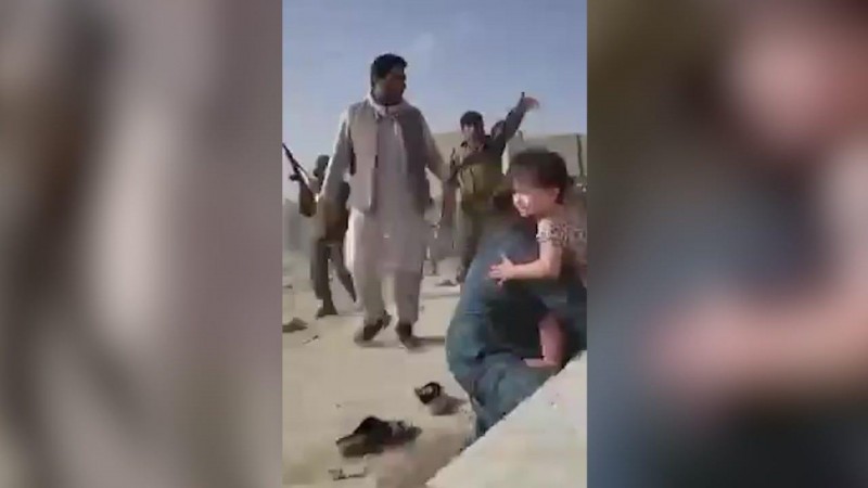 Harrowing video shows gunfire, families with crying children at Kabul airport