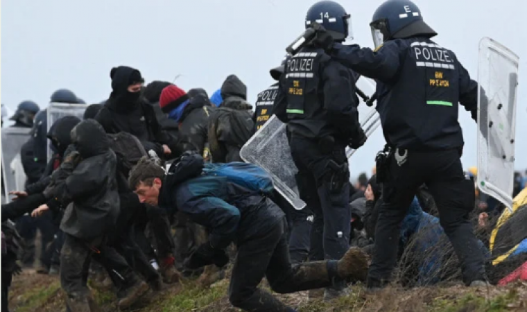 Police and environmental activists fight at a coal mine in Germany