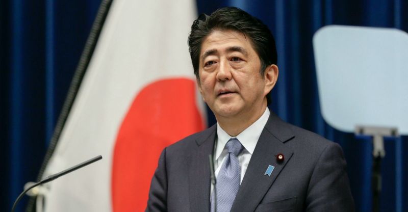 Japanese Prime Minister Shinzo Abe try to end a dispute over islands captured by Soviet troops