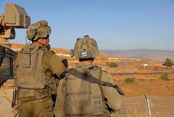 Near the Lebanon-Israel border, Hezbollah members are injured by Israeli fire