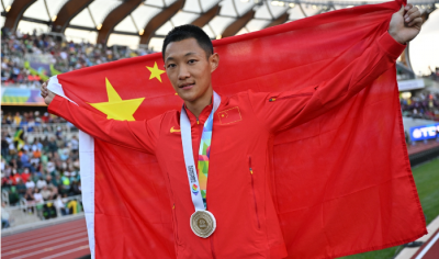 Wang Jianan wins the historic long jump for China at the championships.
