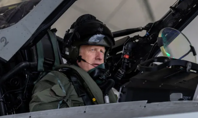 UK’s Boris Johnson enjoys the ride in a Typhoon fighter jet