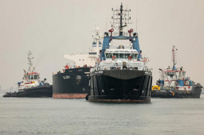 Three tugboats are sent by Egypt to tow an oil tanker after it breaks down in the Suez Canal